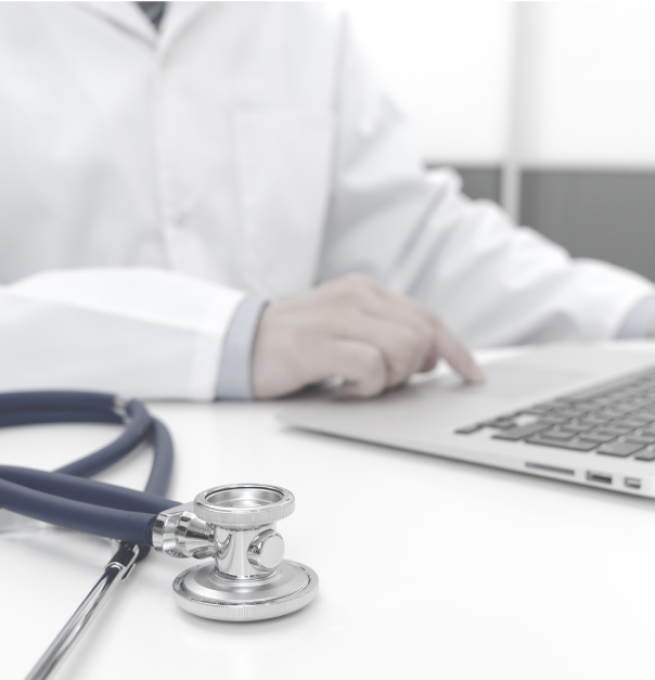 Photo of a doctor using a laptop